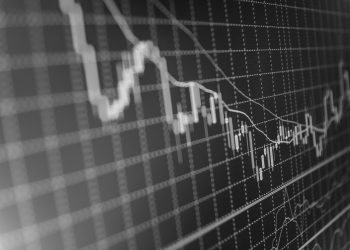 Stock market graph and bar chart price display. Data on live computer screen. Display of quotes pricing graph visualization. Abstract financial background trade colorful Stock exchange trade chart bar candles macro close-up. Shallow depth of field effect. Screen shows stock price rates live. Stock market quotes diagram on monitor.